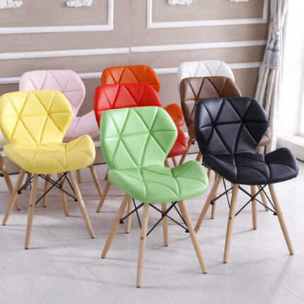 Faux Leather Eames Dining Chair for Modern Homes and Dining Spaces The Faux Leather Eames Dining Chair combines timeless mid-century design with modern comfort, making it an excellent choice for homes, restaurants, cafés, offices, and commercial dining spaces. Designed to complement both contemporary and classic interiors, this stylish chair features a premium faux leather seat, ergonomic backrest, and sturdy legs that provide lasting support. Whether you're furnishing a dining room, breakfast nook, meeting area, or reception space, this chair adds elegance while ensuring exceptional comfort. Crafted from high-quality faux leather, the seat is soft, durable, and easy to maintain. It resists everyday wear and can be wiped clean effortlessly, making it ideal for busy households and commercial environments. Additionally, the cushioned seat and supportive backrest help reduce fatigue, allowing you and your guests to sit comfortably during meals, meetings, or social gatherings. Durable Construction for Everyday Use The Faux Leather Eames Dining Chair is built with a strong frame and durable wooden or metal legs reinforced with sturdy cross supports for enhanced stability. As a result, it offers reliable performance for daily use while maintaining its stylish appearance. Furthermore, the anti-slip foot pads help protect your floors from scratches and improve stability on different surfaces. Despite its robust construction, the chair remains lightweight. Therefore, it is easy to move and reposition whenever you need to refresh your dining or workspace layout. Ideal for Multiple Settings The versatile Faux Leather Eames Dining Chair is suitable for a wide range of environments, including: Dining rooms Kitchens and breakfast areas Restaurants and cafés Hotels and lounges Office meeting rooms Reception areas Waiting rooms Home offices