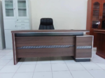 Office desk, office desks Kenya, office desk Nairobi, office table, office tables Kenya, executive office desk, executive desk Kenya, staff office desk, manager office desk, modern office desk, wooden office desk, mahogany office desk, computer desk, workstation desk, ergonomic office desk, L-shaped office desk, straight office desk, curved office desk, office desk with drawers, office desk with storage, office desk with cupboard, office desk with extension, professional office desk, corporate office desk, staff workstation, manager workstation, executive office furniture, modern office furniture Kenya, office furniture Kenya, office furniture Nairobi, office desk for sale, office desks for sale Kenya, buy office desk Kenya, affordable office desk, quality office desk, durable office desk, office desk supplier Kenya, office furniture supplier Kenya, office furniture shop Nairobi, office furniture showroom Kenya, office desk delivery Kenya, office furniture delivery, office desk installation, corporate office furniture, commercial office furniture, ergonomic office furniture, business office furniture, Nairobi, Mombasa, Kisumu, Nakuru,
